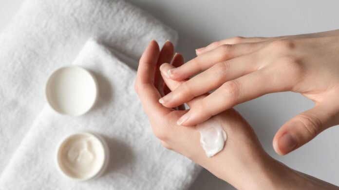 a person applying cream on their hands